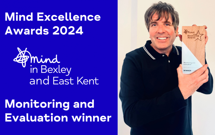 Dr David Palmer CEO of Mind in Bexley and East Kent holding the award