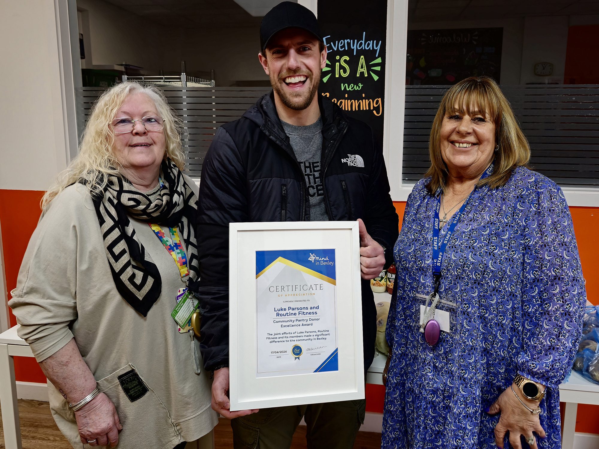 Luke Parsons from Routine Fitness pictured with his certificate and stood with Sue and Viv from Mind in Bexley