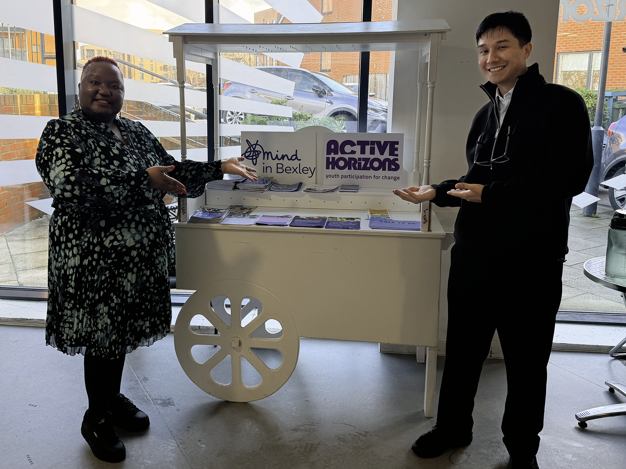 Yeukai Taruvinga, Active Horizons Chief Executive, is stood smiling with Damian Sirso, Mind in Bexley Engagement Officer