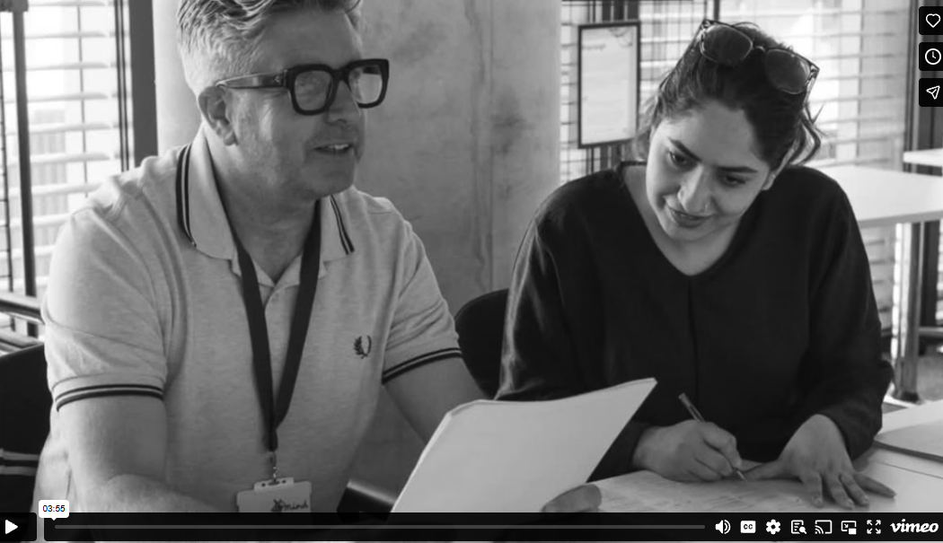 A black and white photograph of Dr David Palmer and Asima Bashir, as they read the People Need People poem