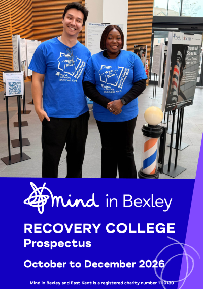Two people wearing blue Mind in Bexley and East Kent Mental Health Awareness Week T-shirts stand beside information displays. Below, text reads: “Mind in Bexley Recovery College Prospectus – October to December 2026.”